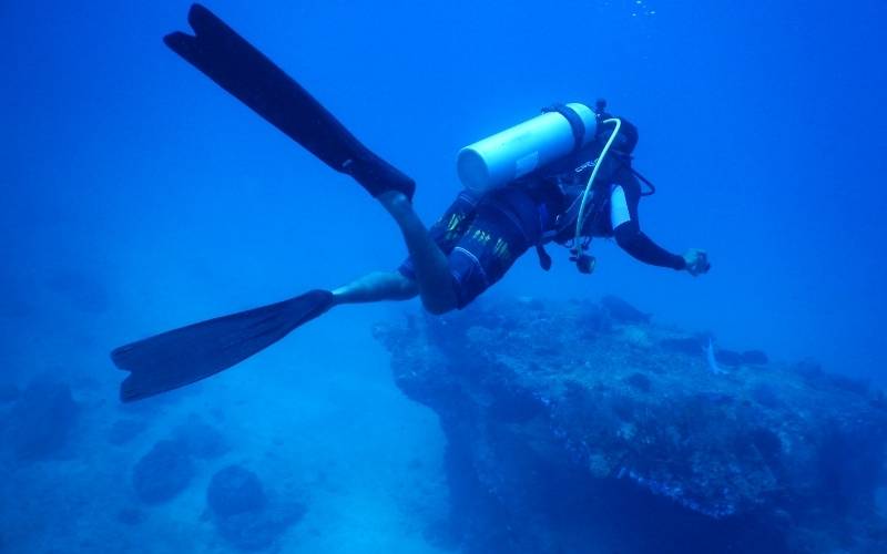 scuba diving on the blue sea